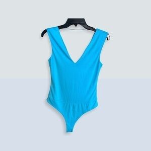 Women’s AFRM tank top shell with snap crotch. Size small petite, aqua blue